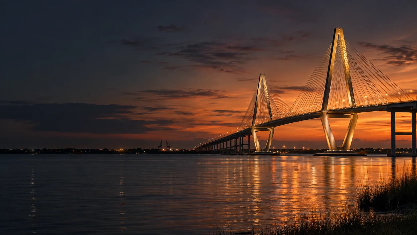 Charleston’s Ravenel Bridge illuminated above the Cooper River at dusk